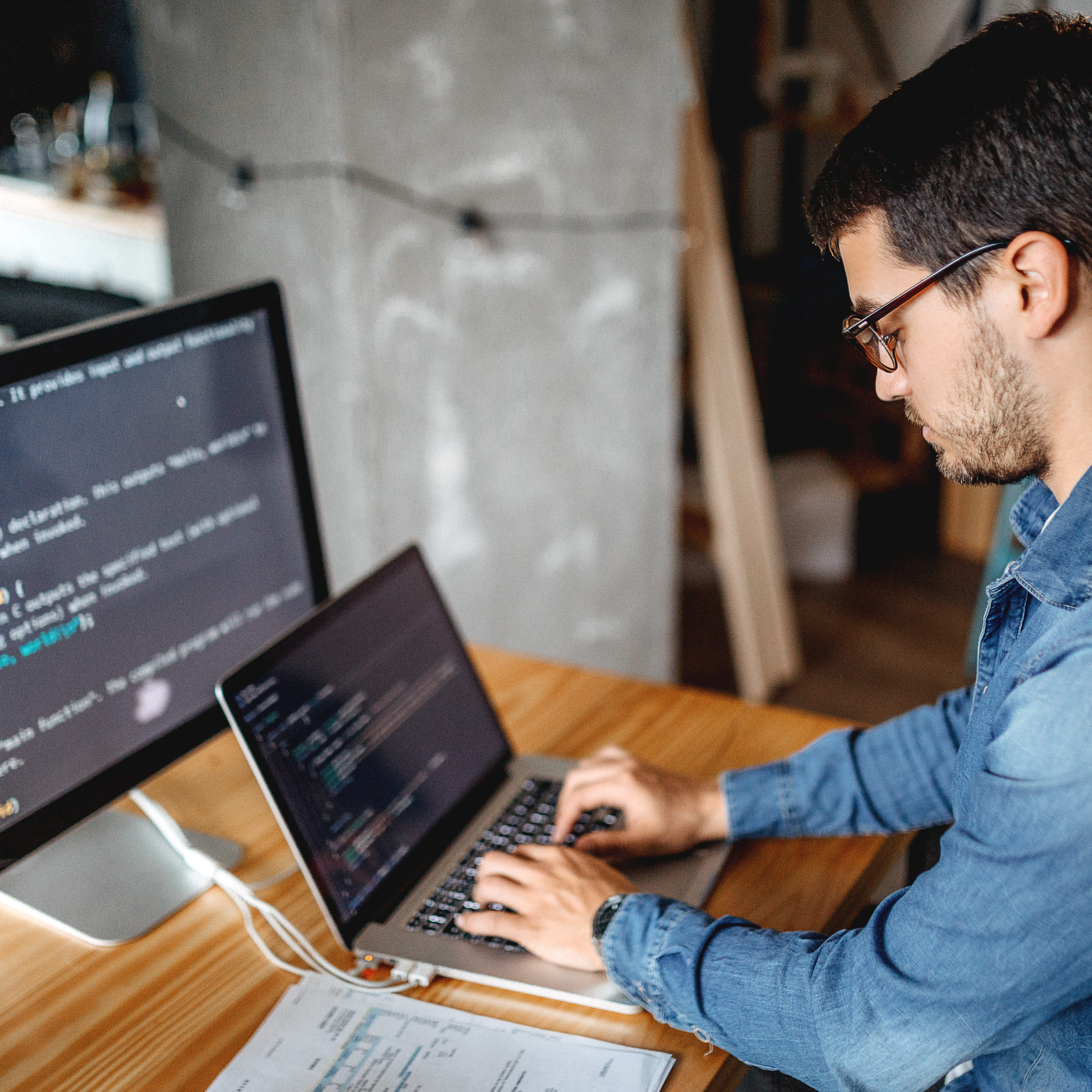 Male programmer working at home in his home office