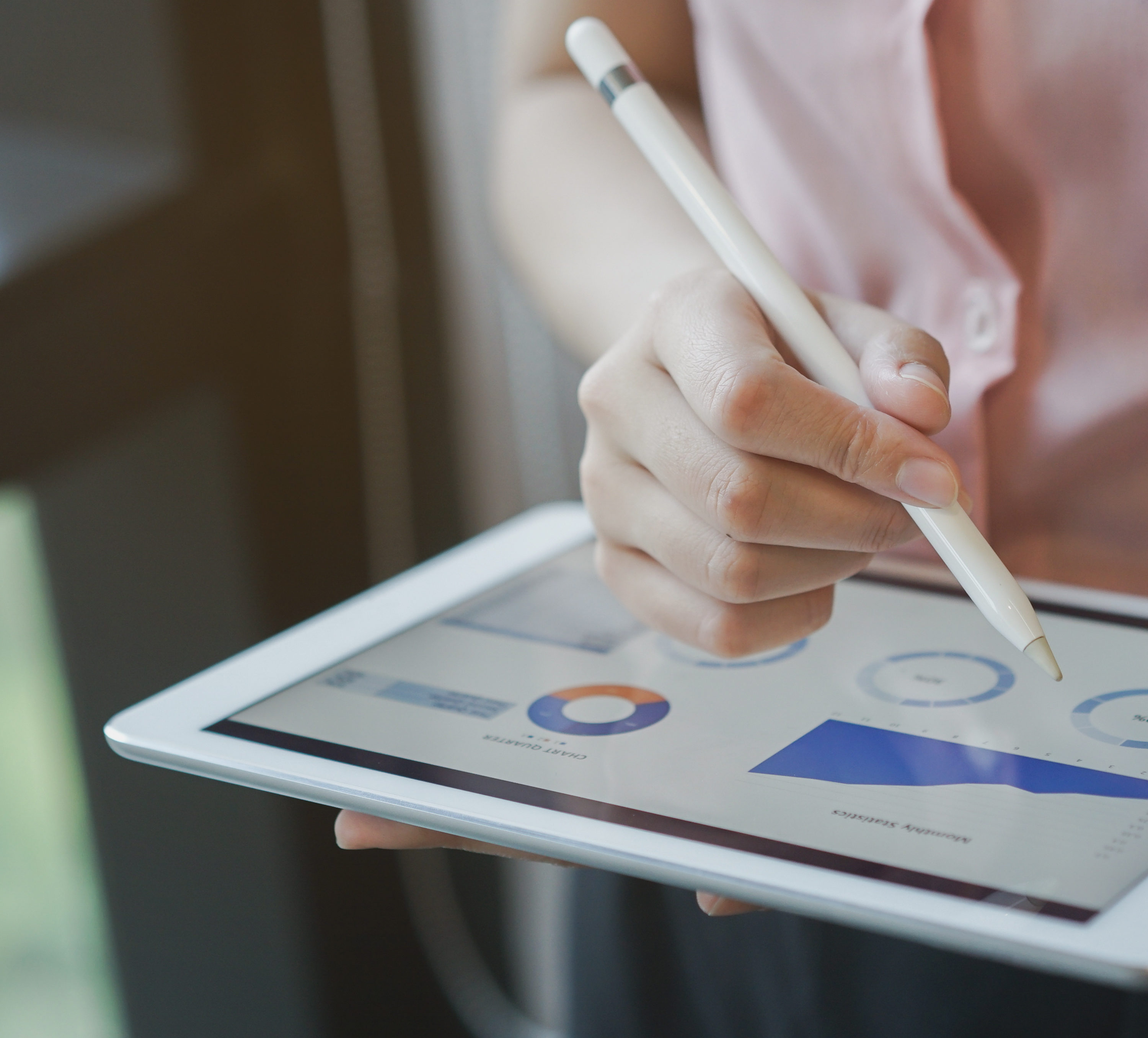 close up on businesswoman manager hand using stylus pen for writing or comment on screen dashboard tablet in meeting situation about company's performance , technology and business strategy concept